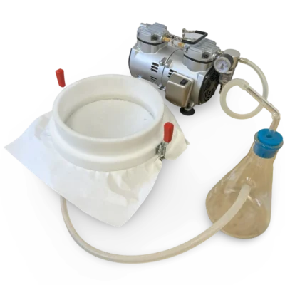 Vacuum filter device equipped with glass collection flask and filter paper in sample processing.