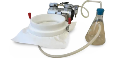 Laboratory vacuum filter with powerful vacuum pump in use.