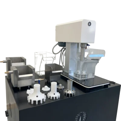 Side view of laboratory flotation testing machine with stainless steel flotation tanks, acrylic cells and spare impeller diffuser parts, D-12 type configuration