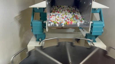 Feeding area of rotary sample divider which has 8 containers each 4 liters volume.