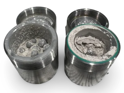 Stainless steel grinding jars used in Vibratory Ball Mill during sample preparation process.