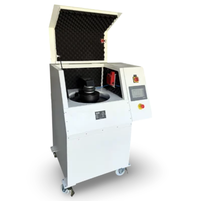 Unal HO-1500 vibratory disc mill with lid open, showing pneumatic clamping mechanism, grinding bowl and acoustic-lined enclosure